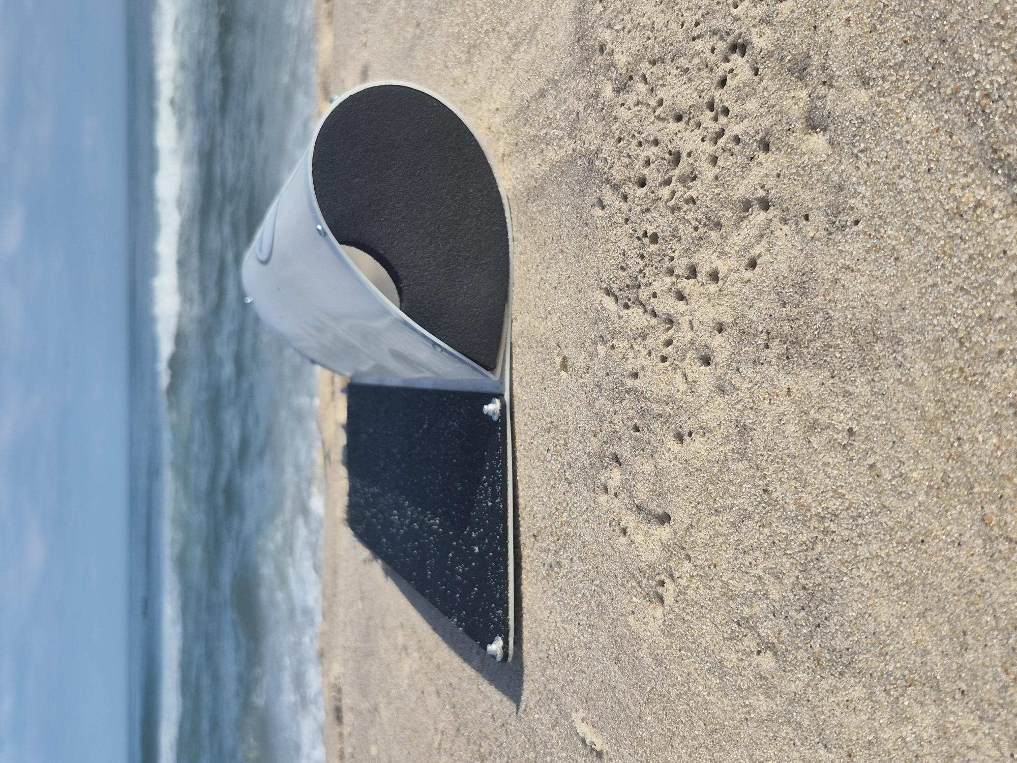 Side profile of the SandySled product on beach sand