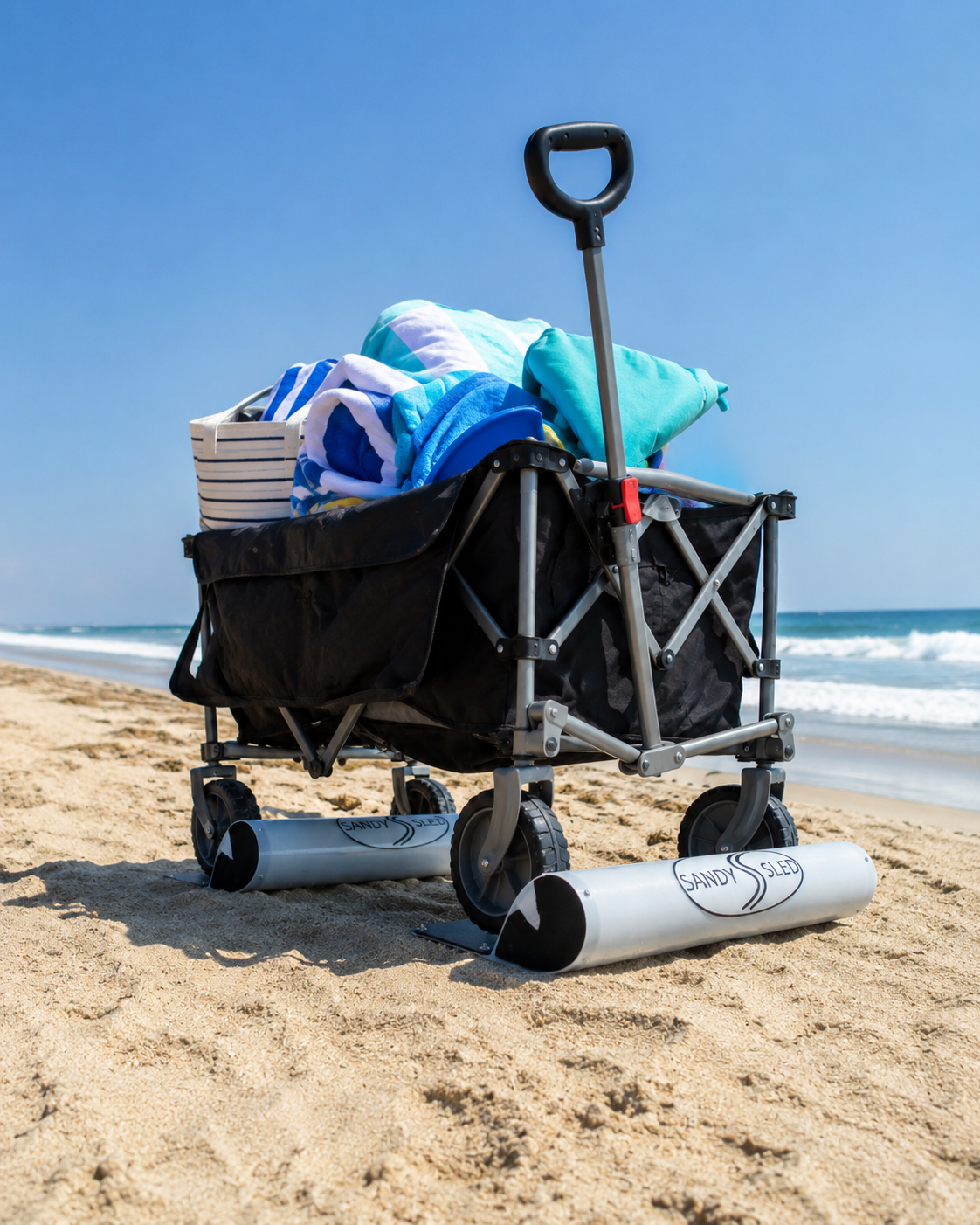 Loaded beach wagon using SandySled on soft sand